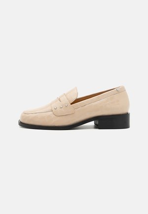 Beige leather loafers with a crocodile texture, featuring a square toe and three metallic star accents on the top. Black low heel.