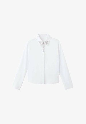 Camicia bianca a maniche lunghe con colletto, caratterizzata da decorazioni argentate vicino al collo e una vestibilità dritta e su misura. Tessuto dalla consistenza liscia.