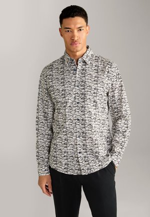 Button-up shirt with a black and white wave pattern, long sleeves, collared neckline, and a smooth fabric texture.