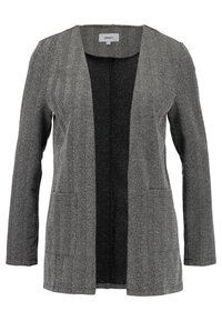 Sako s kostkovaným vzorem v černé a bílé barvě, s dlouhými rukávy, otevřeným předním dílem a dvěma předními kapsami, které ukazuje texturovanou látku.