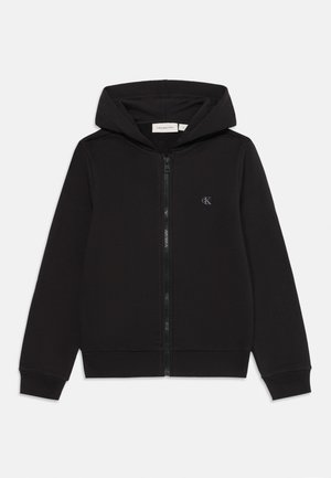 Sweat-shirt zippé noir avec fermeture éclair à l'avant, poche kangourou, poignets et ourlet côtelés. Présente un petit logo sur la zone gauche de la poitrine. Texture de tissu lisse.