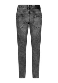 Jeans ajustados de mezclilla gris oscuro, con una textura suave, cinco bolsillos y una cinturilla estándar. La vista trasera enfatiza la forma de los bolsillos.