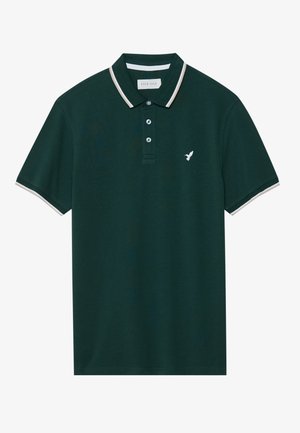 Dark green polo shirt in cotton with a classic collar, three-button placket, and white striped accents on the collar and sleeves. Features a logo on the chest.