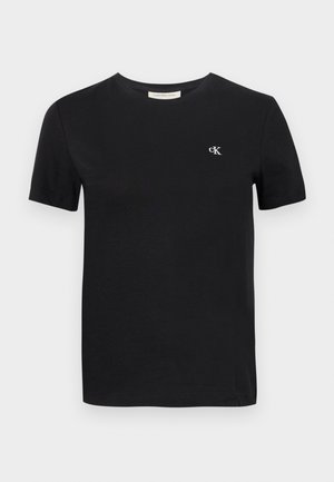 Fekete pamut póló klasszikus kerek nyakkal, rövid ujjakkal és egy kis fehér hímzett "ck" logóval a mellen.