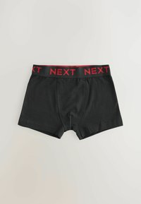 Černé boxerky s červeným elastickým pasem se nápisem "NEXT". Hladký materiál, přiléhavý střih a krátká délka nohavic s detaily v šití.