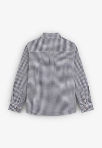 Camisa de cuadros con un patrón en azul y blanco, de manga larga, puños abotonados y un cuello clásico. Hecha de una tela suave, con un detalle de yugo trasero.