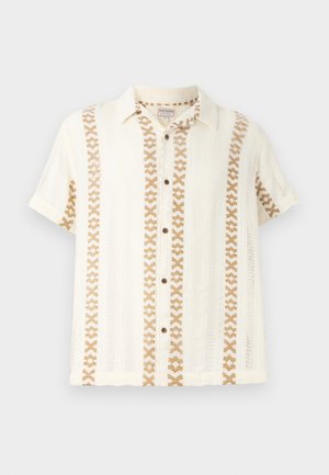 Trumpas rankovės mygtukų marškiniai bežinėje ir kreminėje spalvose, su audiniu su raštais ir tekstūruotu paviršiumi. Daugiaspalvė juostelėdė dizainas priekyje.