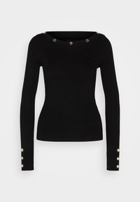 Pull noir à manches longues avec une texture côtelée. Il présente un large col orné de clous dorés autour du col et trois boutons dorés sur chaque manche.