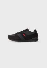 Black and gray athletic shoes with suede and textile materials, featuring a red logo, textured sole, and a classic running shoe silhouette.