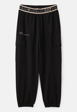 Pantaloni sportivi neri con vestibilità affusolata, vita elasticizzata con banda logata beige e tasche laterali, realizzati in morbido tessuto testurizzato.