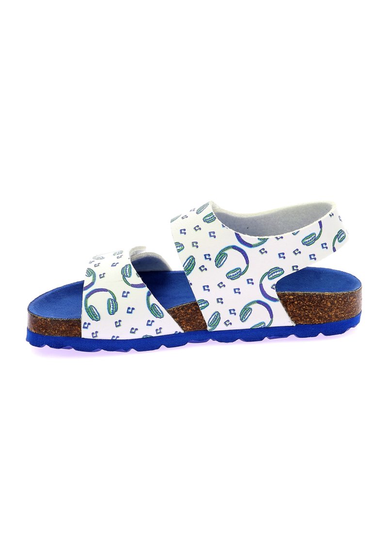 Sandalias blancas con un patrón de auriculares verdes y azules repetidos, suela de corcho y fondo de goma azul. Cuentan con correas ajustables para un mejor ajuste.