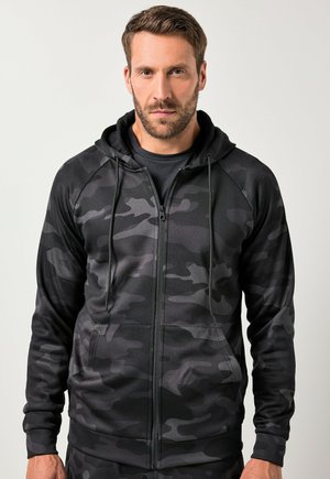 Zwarte camouflage zip-up hoodie met een voorkant rits, verstelbare trekkoordcapuchon en zijzakken. Gemaakt van gladde, rekbare stof.