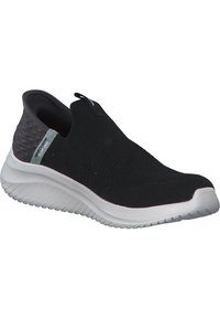 Sneaker nera senza lacci con superiore in maglia testurizzata, colletto elasticizzato e una suola bianca imbottita. Presenta un'affascinante accentuazione grigia sul tallone.