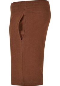 Bruine katoenen korte broek met een zijzak, elastische tailleband en een gladde textuur, met een knielange snit en eenvoudig ontwerp.