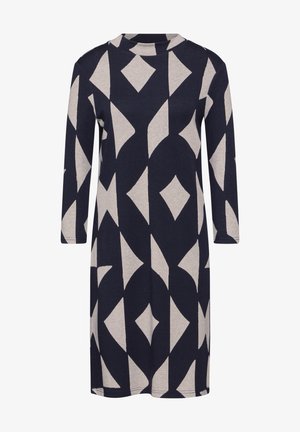 Mørkeblå kjole med geometrisk cremefarvet mønster, udstyret med lange ærmer og høj halsudskæring, lavet af blødt, let materiale.