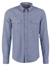 Blue long-sleeve shirt made of textured fabric featuring two chest pockets, button-down collar, and a subtle pattern throughout.