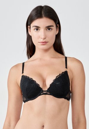 Black lace bra with a plunging neckline, featuring scalloped edges, floral patterns, adjustable straps, and gold-tone hardware accents.