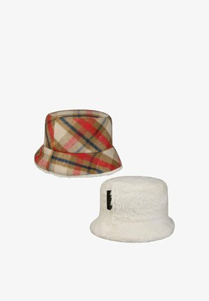 Two bucket hats: one with beige, red, blue, and brown plaid pattern; the other white and fluffy with a black label on the side.