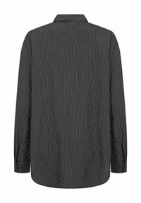 Black striped long-sleeve shirt with a classic collar and buttoned cuffs, featuring a textured fabric and a straight hem at the back.