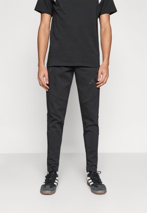 TIRO TRAVEL PANTS - Trainingsbroek - black