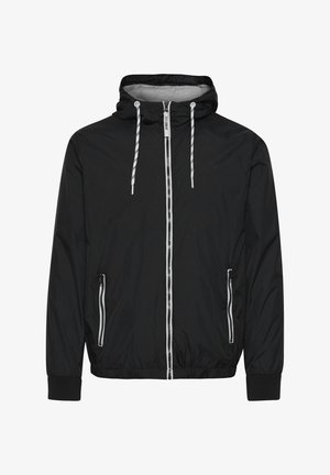 Must kolektori mustritega must windbreaker jope, mis on valmistatud kergetest materjalidest. Omab kapuutsi, kahte esimest lukuga taskut, elastseid mansette ja kontrastseid valgeid nööre.