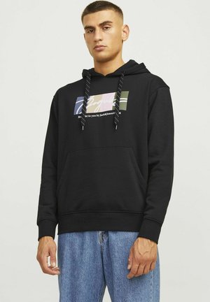 Black hoodie with a front pocket, featuring a multicolored graphic design and drawstrings. Material appears soft and thick, suitable for casual wear.