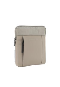 Astuccio rettangolare beige con cerniera, sezione superiore in tessuto e nome del marchio "JOOP! JEANS" in rilievo sulla pannello frontale.
