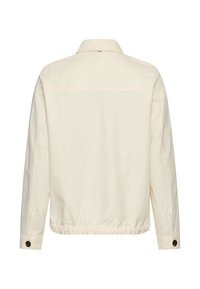 Light beige long-sleeve jacket with buttoned cuffs, short collar, and elastic hem, shown from the back on a white background.