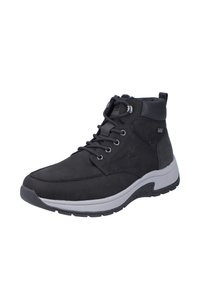 Zapato de senderismo negro de media caña con materiales de ante y sintéticos, diseño con cordones, cuello acolchado y suela de goma gris. Presenta un branding sutil.