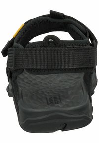 Black sandals with a textured rubber sole, featuring adjustable straps and a padded heel for comfort. Back view showing sturdy construction.