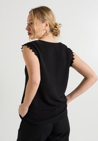 Grain de Malice SANS MANCHES - Blusa - noir