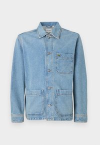 Light blue denim jacket with a button front, pointed collar, two front pockets, and a small green crocodile logo on the chest pocket.