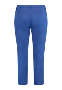 Modré kalhoty z hladkého materiálu, se širokým střihem, poutky na opasek a ohrnutými kotníky. Zadní strana neobsahuje kapsy.