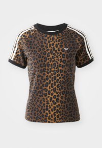 Camiseta de leopardo de manga corta, con cuello redondo de canalé negro y franjas laterales blancas. Fabricada en una tela suave con un corte relajado.