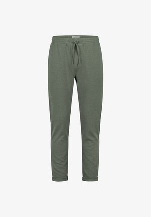 Olivgrüne, schmal zulaufende Jogginghose mit Kordelzug in der Taille und Bündchen an den Knöcheln, aus strukturiertem Stoff, mit der Aufschrift „EIGHT2NINE“ auf der Innenseite des Bundes.