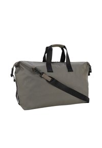 Bolsa de viaje de tela gris y duradera, con asas dobles, correa para el hombro ajustable y cierre con cremallera. Presenta un diseño minimalista y hardware resistente.