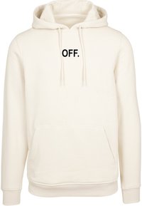 Sweat à capuche couleur crème avec une poche kangourou à l'avant, une capuche ajustable par cordon et le texte "OFF." en noir sur la poitrine. Tissu doux et texturé.