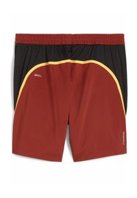 Bañador rojo y negro con cintura elástica, que presenta detalles amarillos y una tela texturizada. Incluye una marca en el lado.