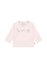 Light pink long-sleeve shirt featuring three black and white dog illustrations across the front. Includes a round neckline and button detail.