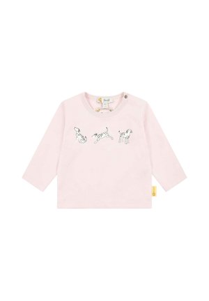 Light pink long-sleeve shirt featuring three black and white dog illustrations across the front. Includes a round neckline and button detail.