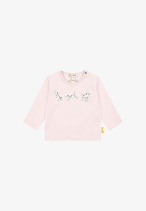 Light pink long-sleeve shirt featuring three black and white dog illustrations across the front. Includes a round neckline and button detail.