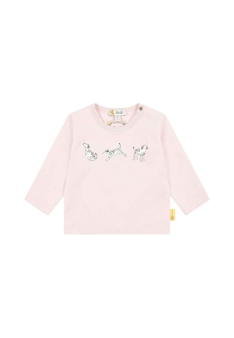 Light pink long-sleeve shirt featuring three black and white dog illustrations across the front. Includes a round neckline and button detail.