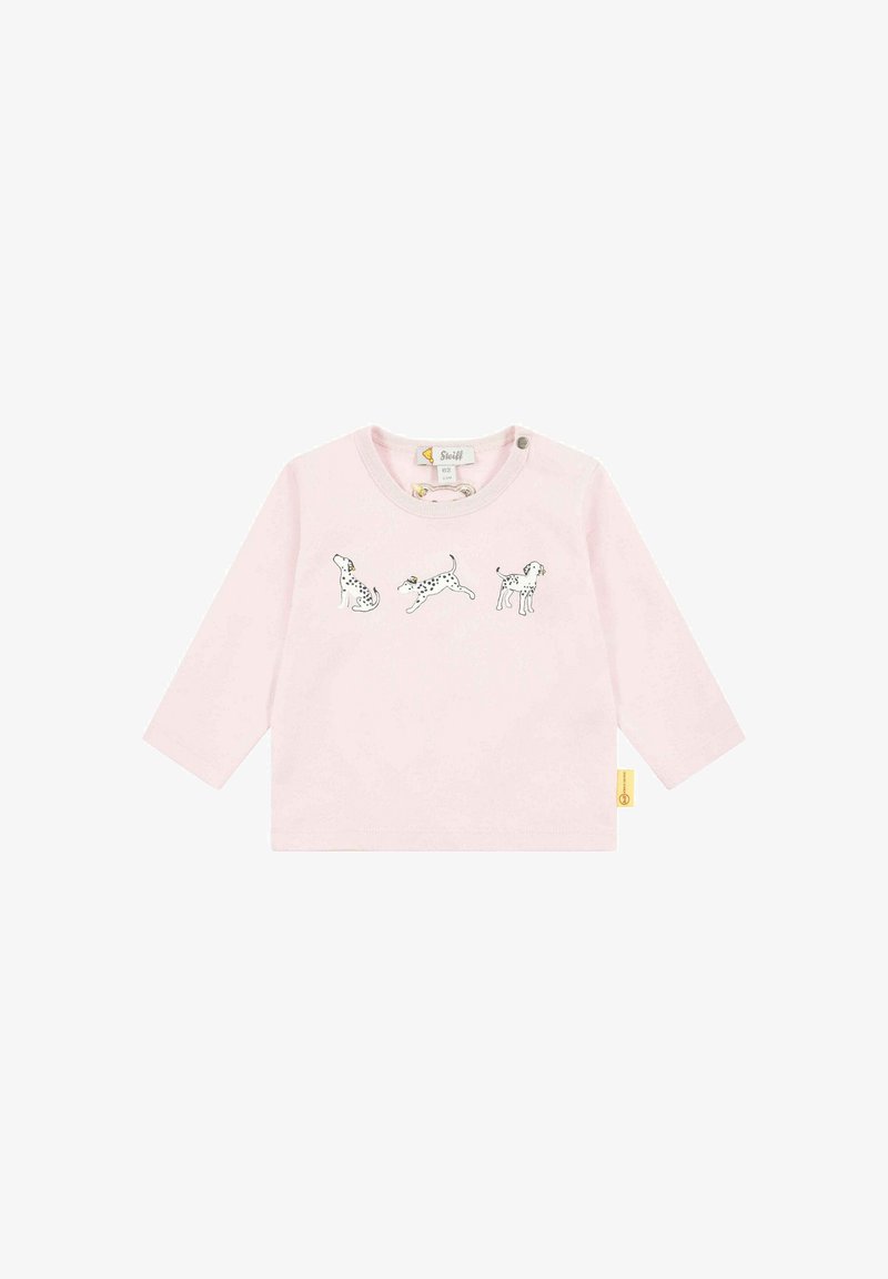 Langärmliges, hellrosa Shirt mit drei schwarz-weißen Hundillustrationen auf der Vorderseite. Mit Rundhalsausschnitt und Knopfdetails.