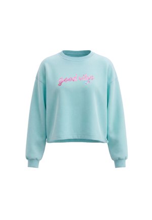 Felpa azzurro chiaro con maniche lunghe e polsini a costine, con testo rosa "good vibes" e una piccola farfalla sul davanti.