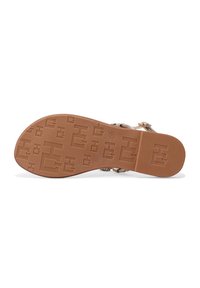 Sole di sandalo realizzata in un materiale gommoso marrone chiaro, con un motivo testurizzato, il marchio impresso e la taglia 37 indicata sul fondo.