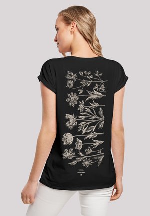 Schwarzes T-Shirt mit kurzärmeligem Schnitt, das auf der Rückseite mit einem detaillierten floralen Grafik in Hellgrau verziert ist. Es besteht aus weichem Stoff, hat eine lockere Passform und einen runden Halsausschnitt.