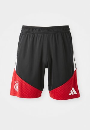 Svarte og røde trening shorts med et teksturert rødt mønster, elastisk midjebånd og hvit Adidas-logo på kanten.