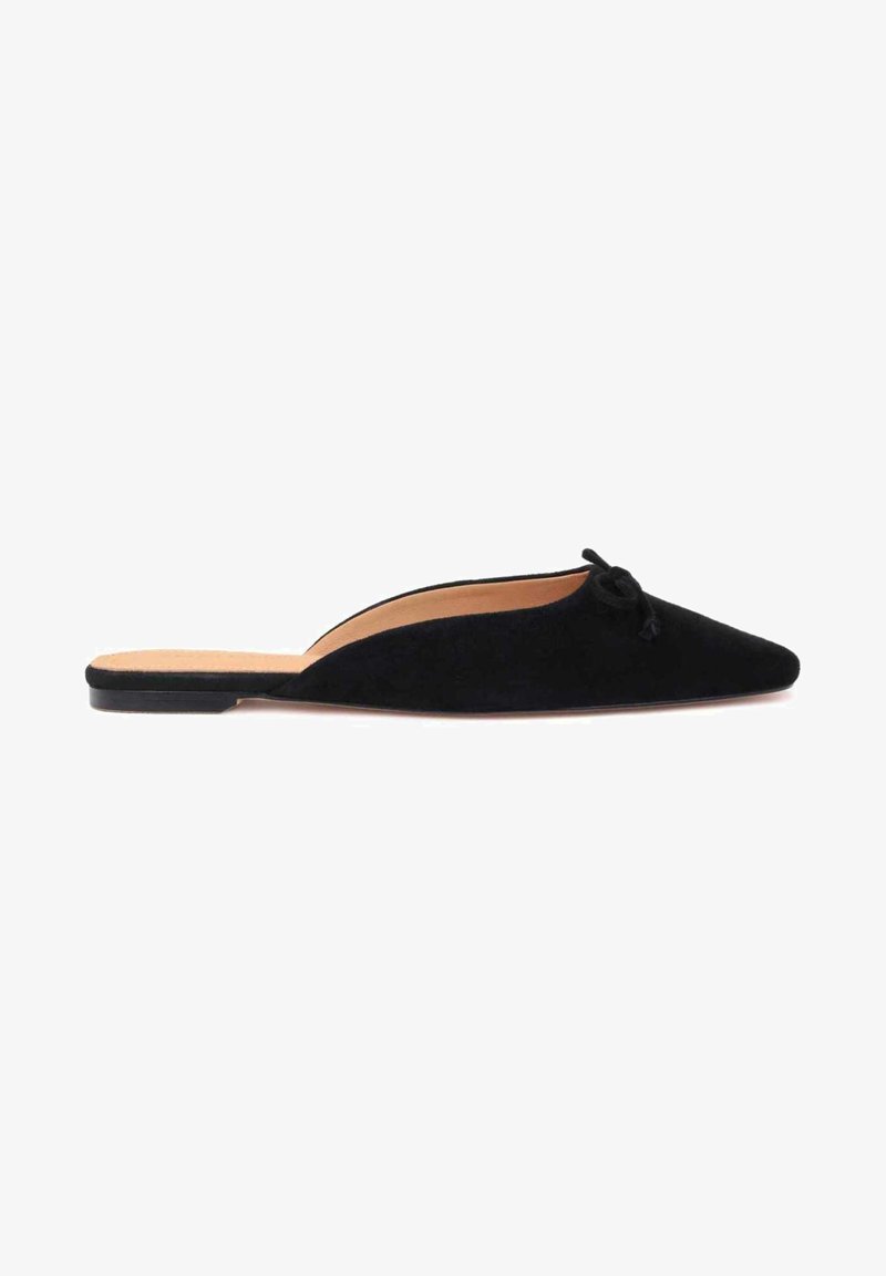 Black suede slip-on shoe with a pointed toe and a small decorative bow on the vamp, featuring a flat sole and an open back.