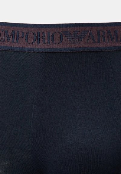 Navy stretch cotton boxer briefs with a dark maroon elastic waistband featuring embossed "EMPORIO ARMANI" branding and a logo design.