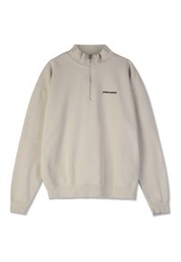 Beige genser med kvart glidelås, lange ermer, ribbestrikkede mansjetter og brodert "PEGADOR"-logo i svart på brystet.